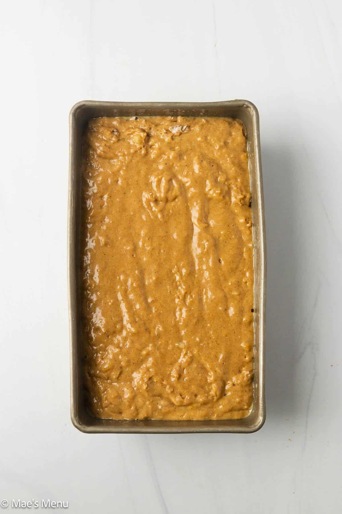 The baking pan full of high protein banana bread before baking.