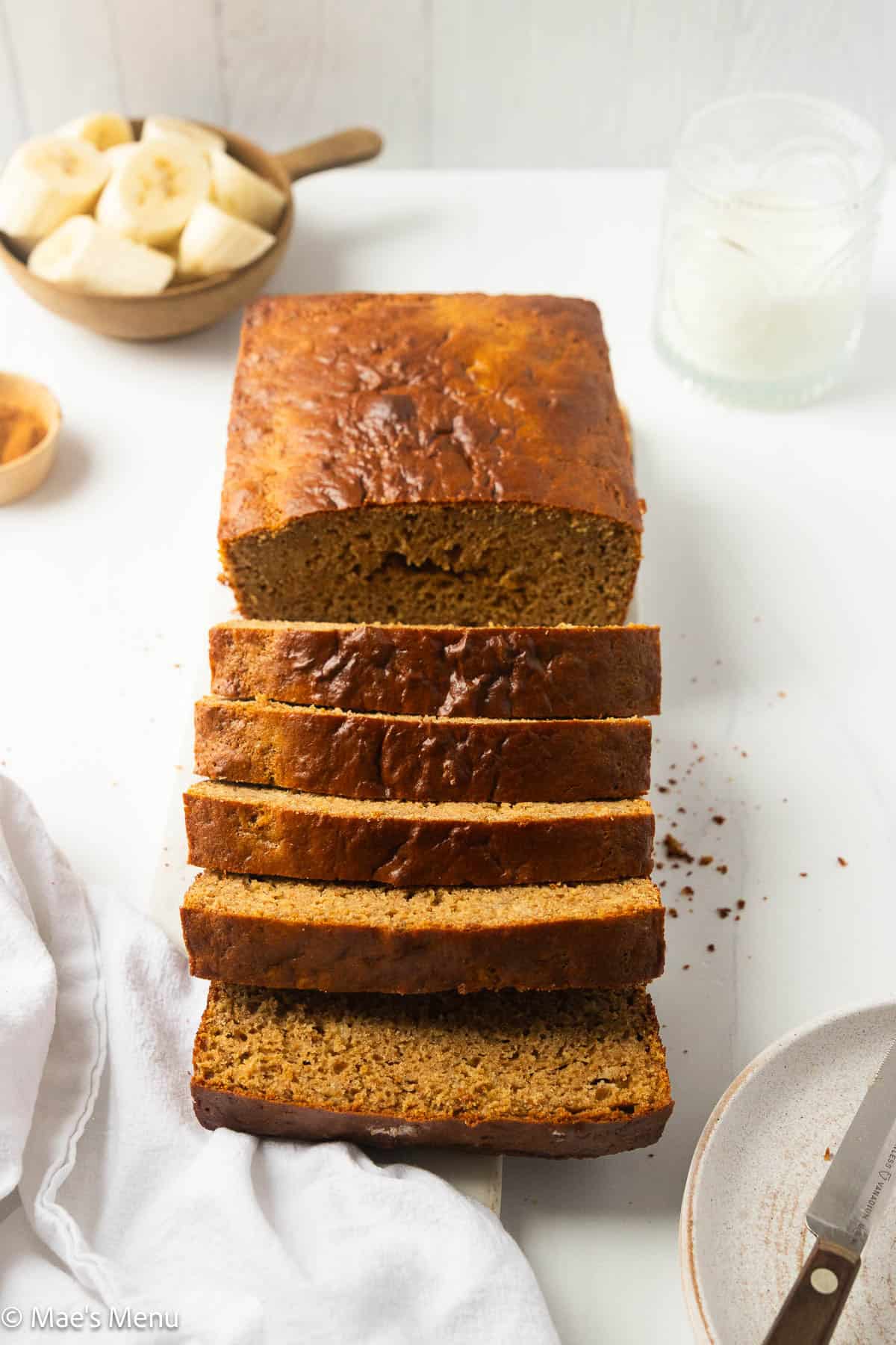 Angled shot of a sliced loaf of healthy protein banana bread.