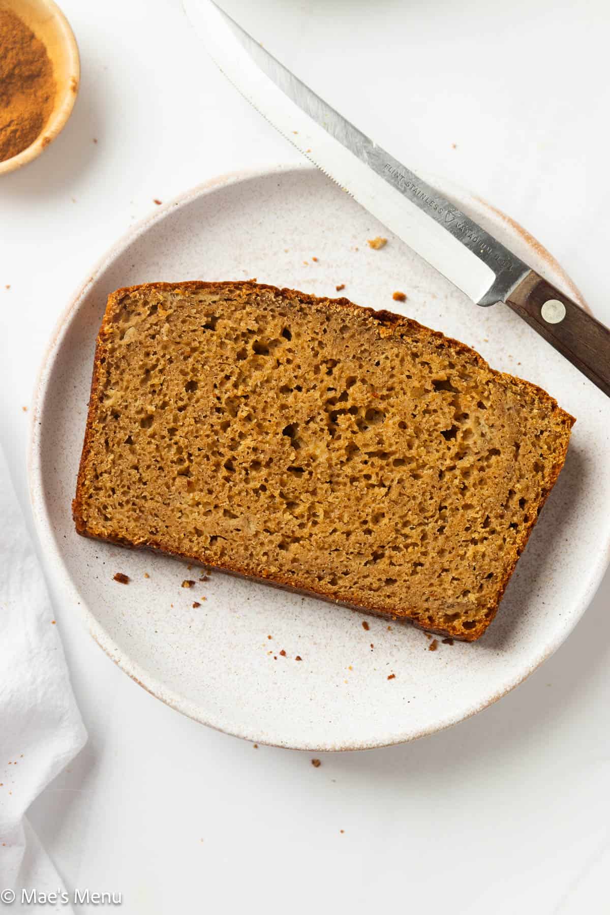 A close-up overhead shot of a sliced of healthy banana bread with protein powder.