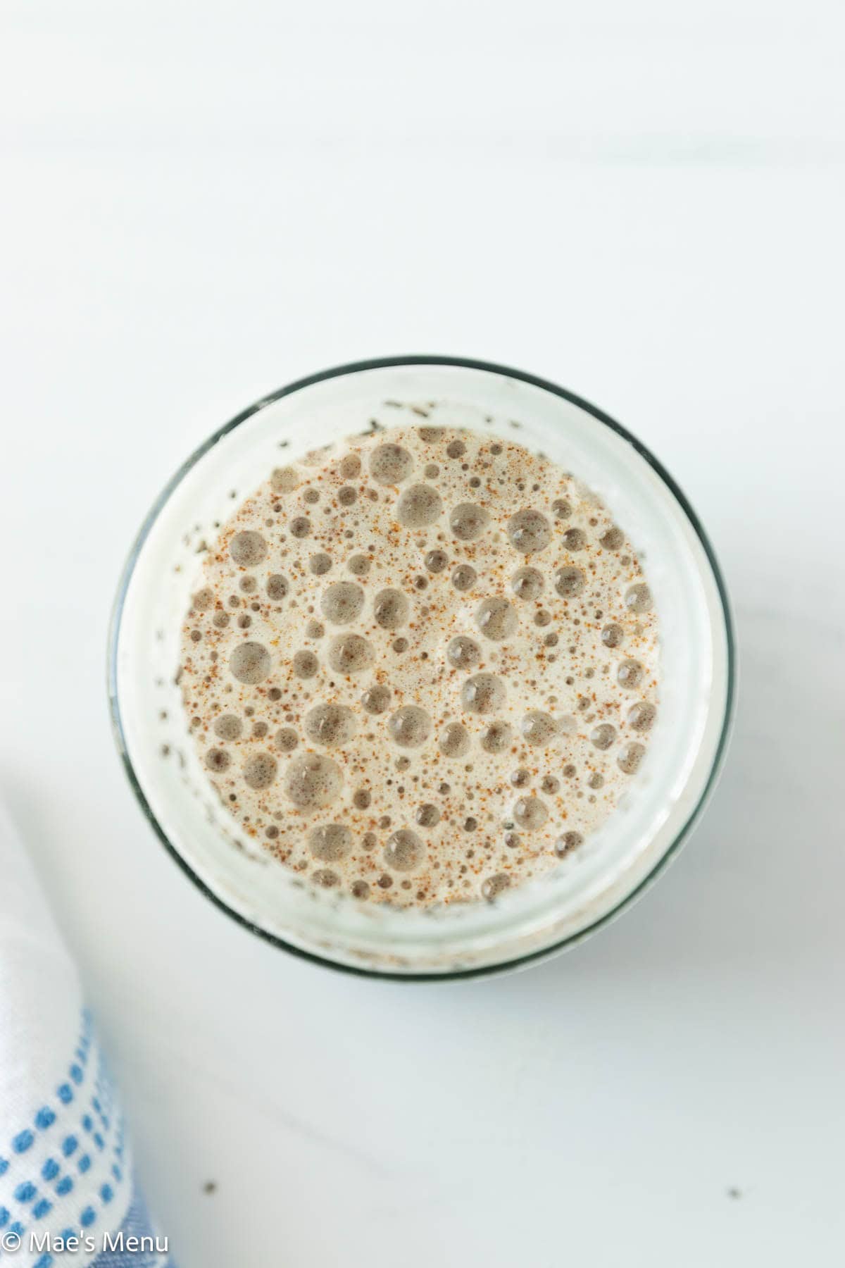 An overhead shot of the mixed chia seed pudding in a glass jar.
