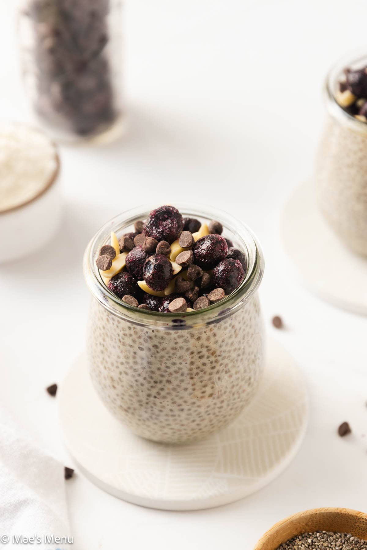 An angled shot of a small cup of protein powder chia pudding. 