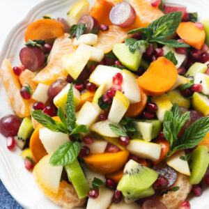 A close-up shot of a bowl of winter fruit salad.