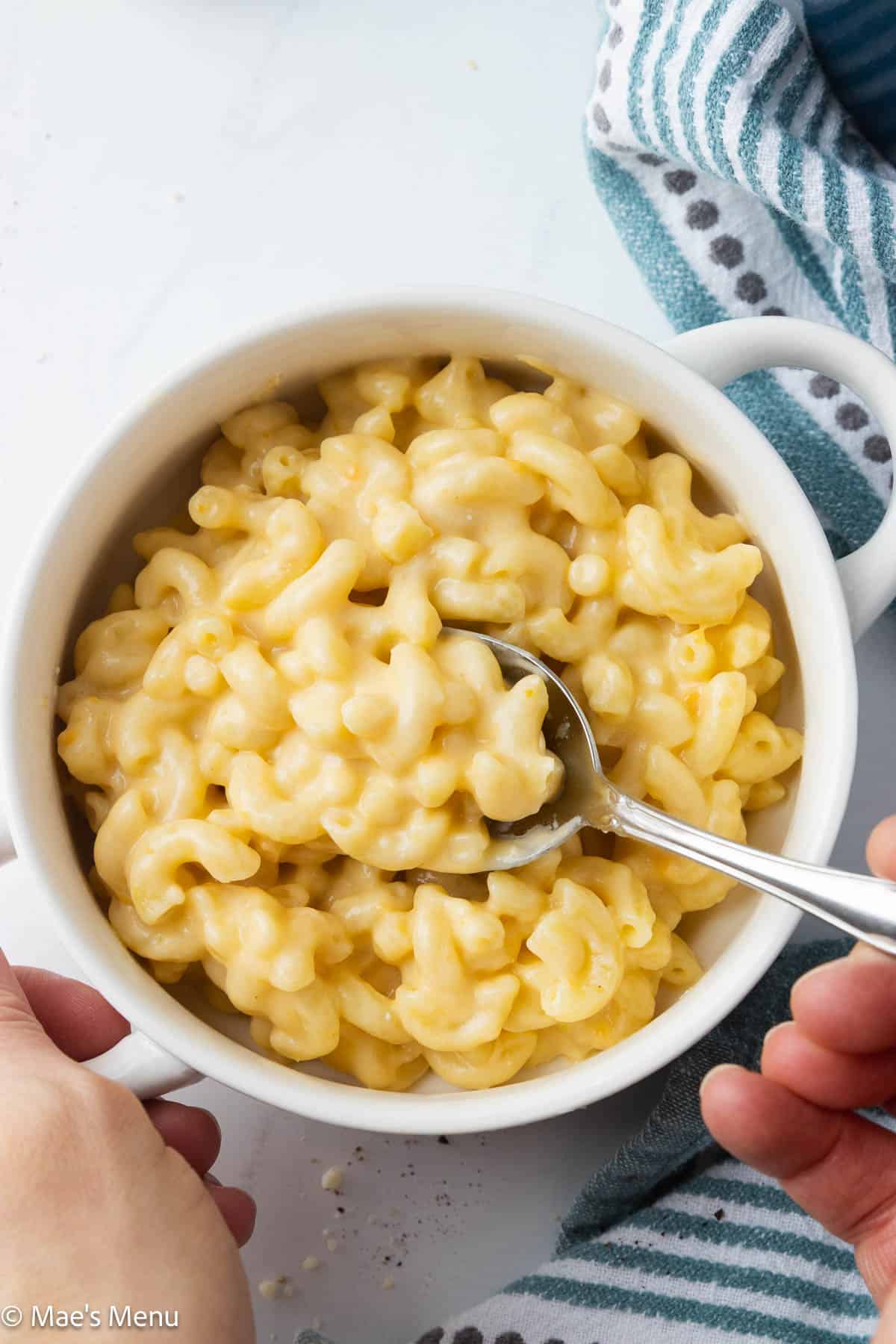 Dishing up a scoop of overhead shot of 3 cheese mac and cheese.