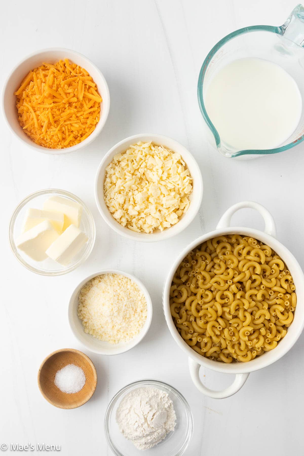 An overhead shot of all the ingredients needed to make 3 cheese mac and cheese.