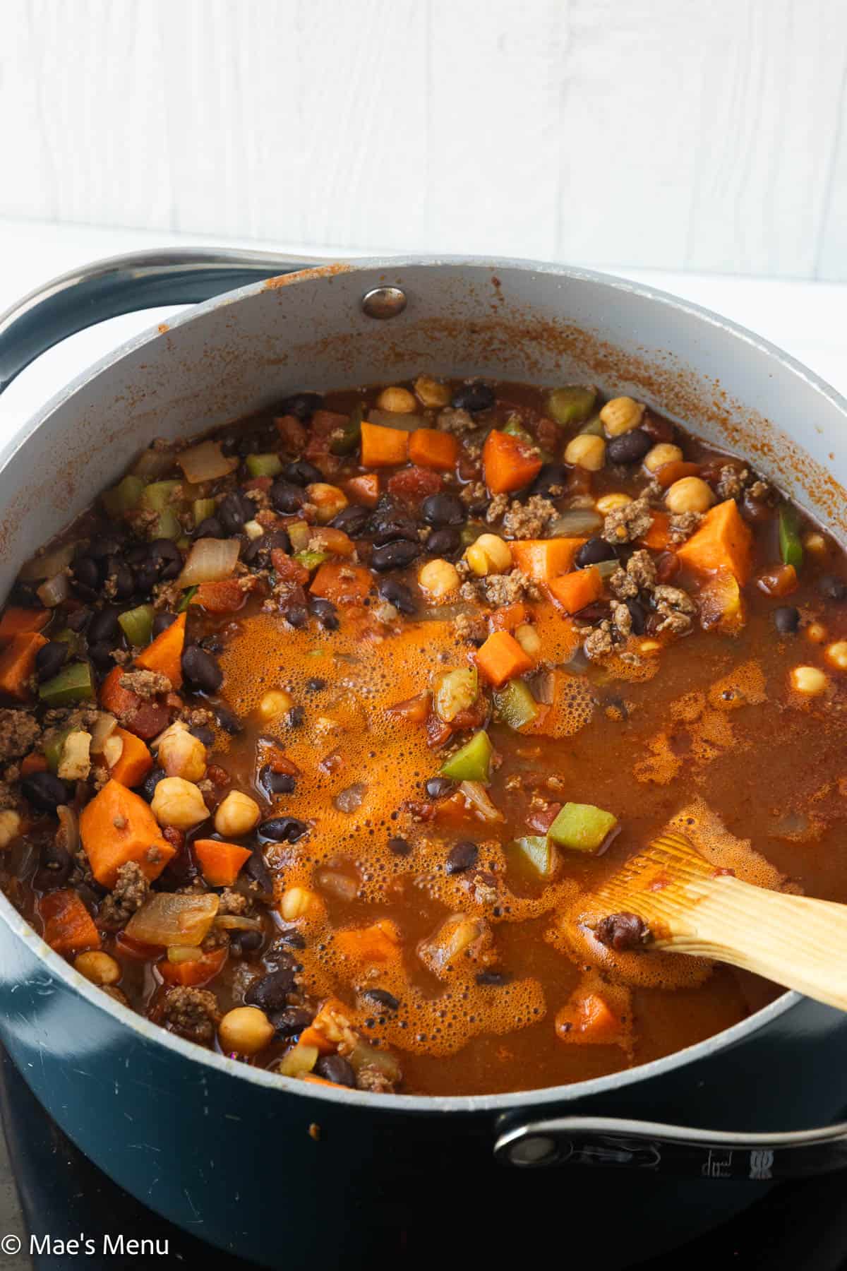 The chili simmering in a large pot.