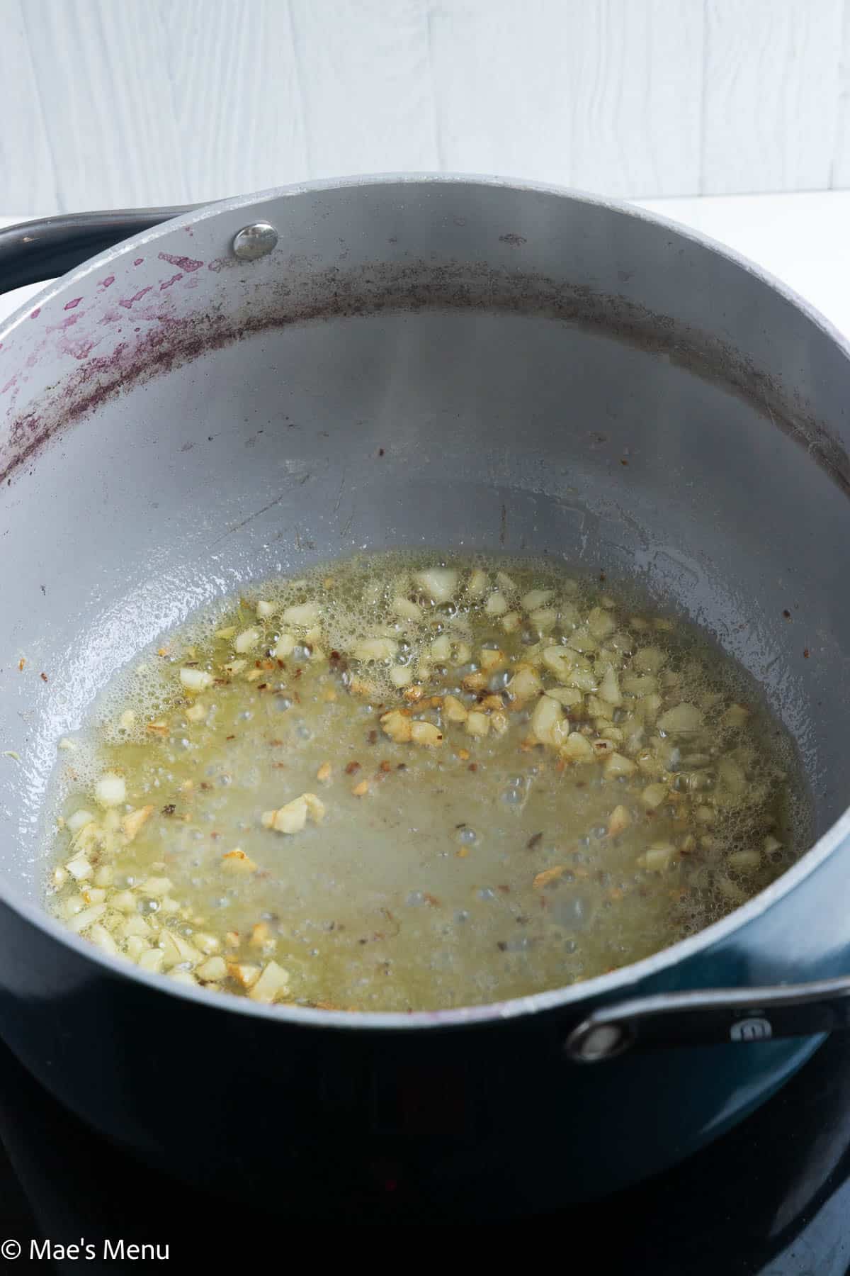 Garlic browning in butter and oil.