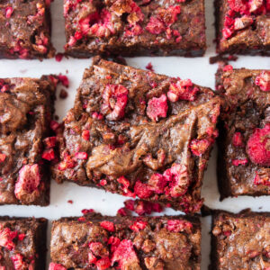 Close-up shot of sliced raspberry brownies on the counter.