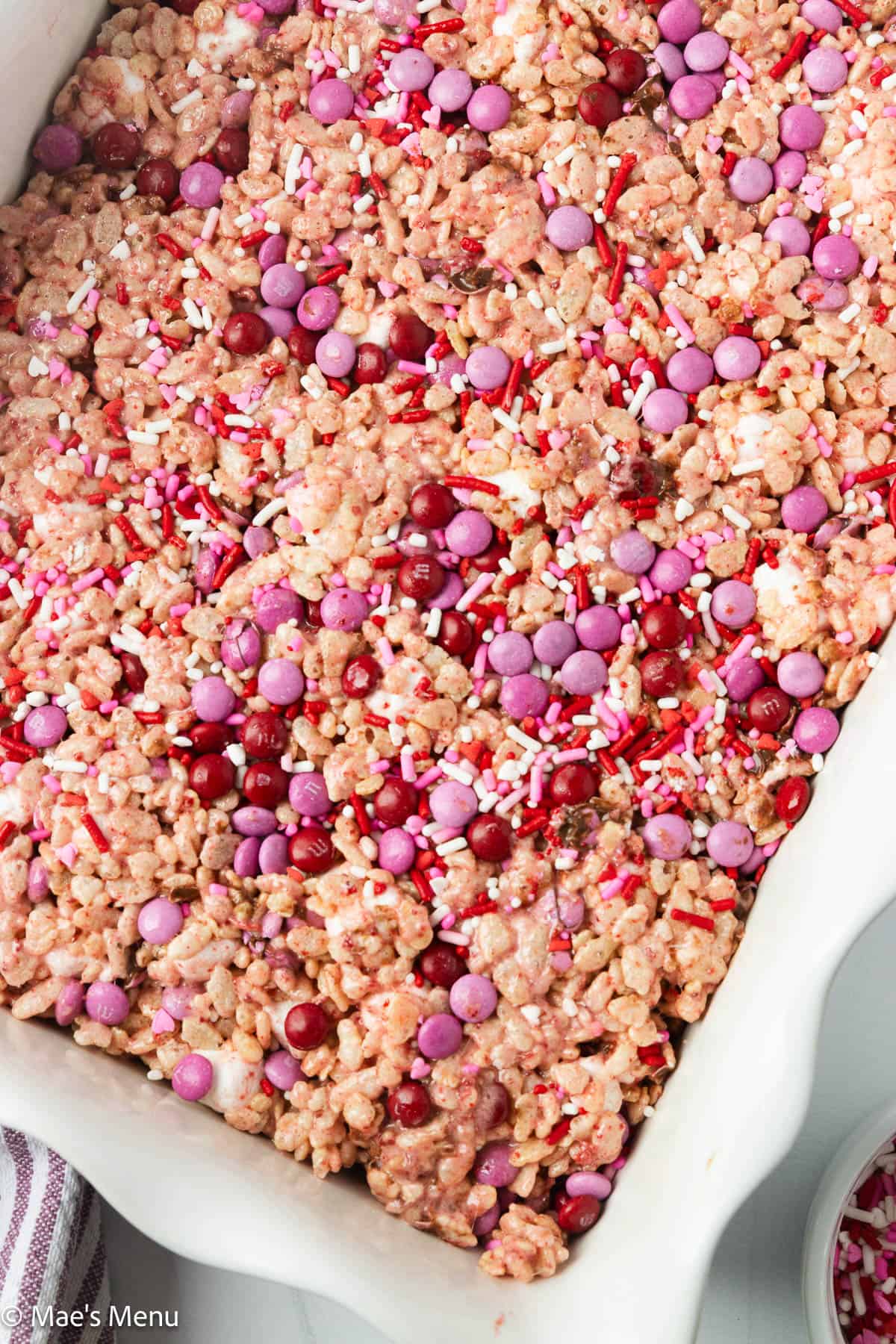 An overhead shot of a pan of strawberry rice krispies.