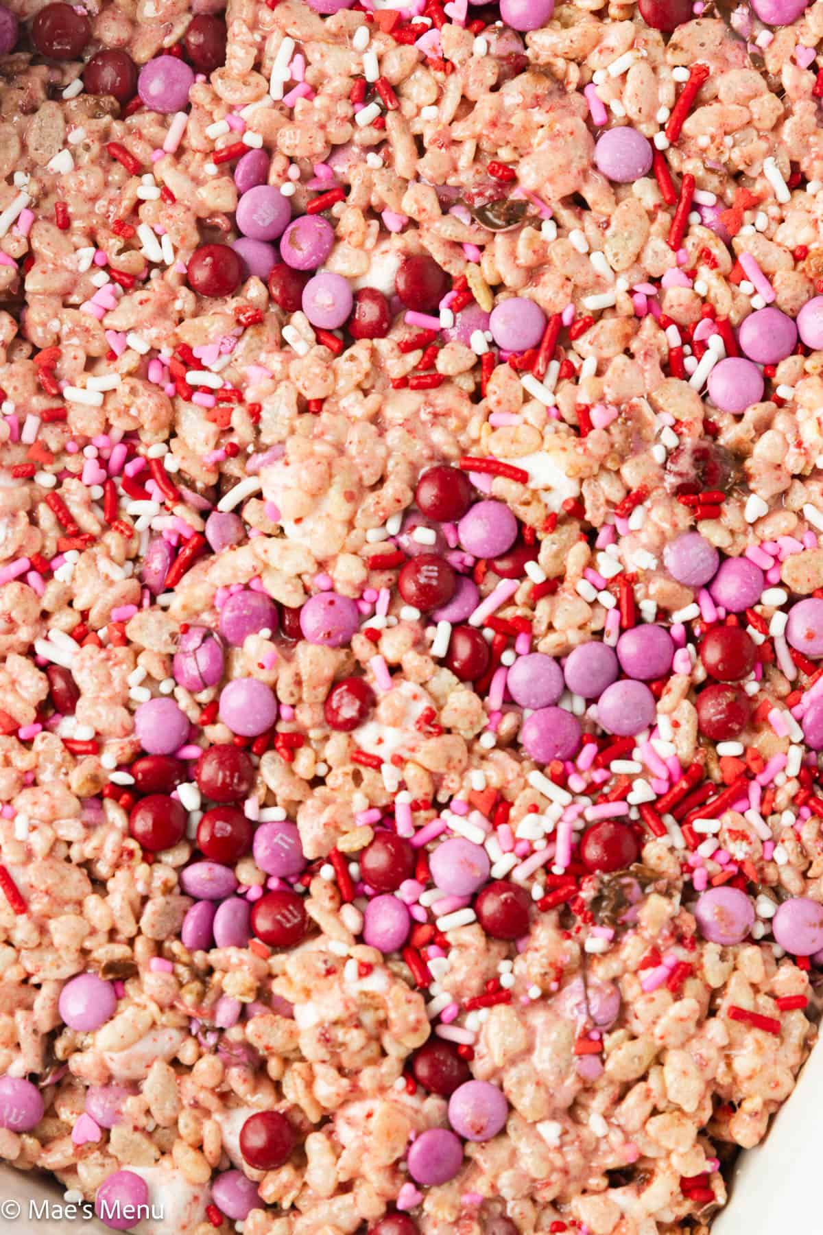 A close-up shot of a pan of strawberry rice krispies.