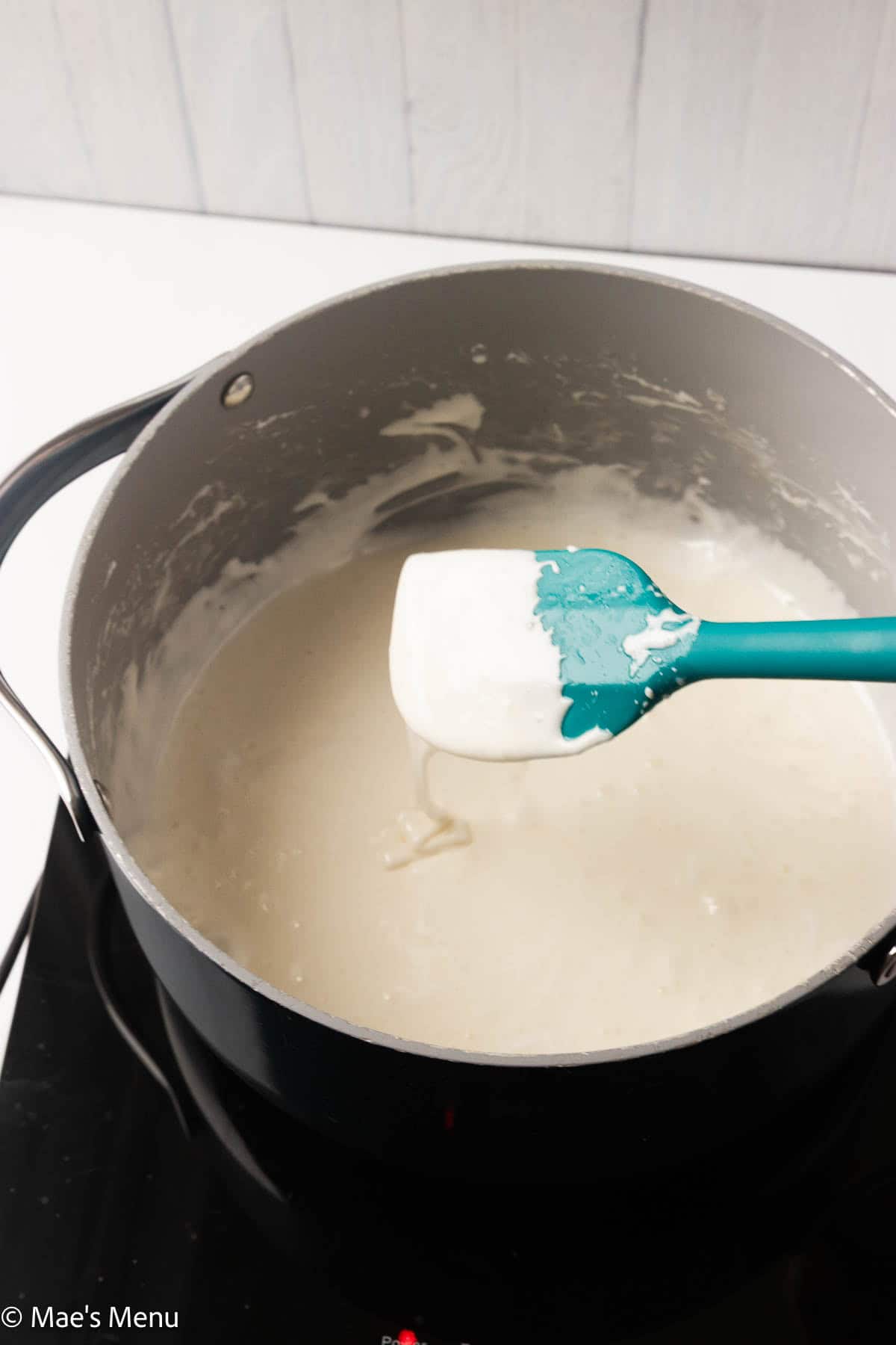 Melted marshmallow mixture in a pot.