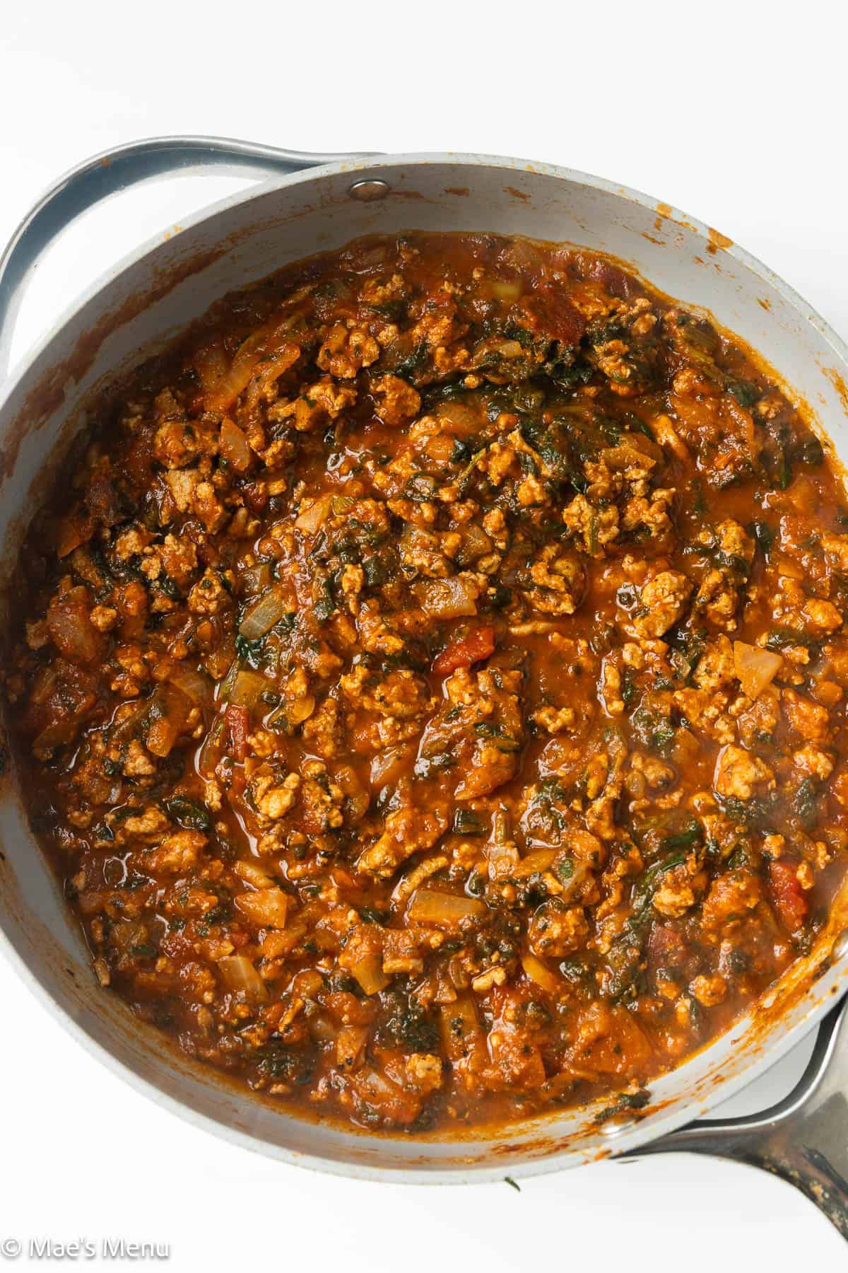 An overhead shot of a pan of the meat sauce.