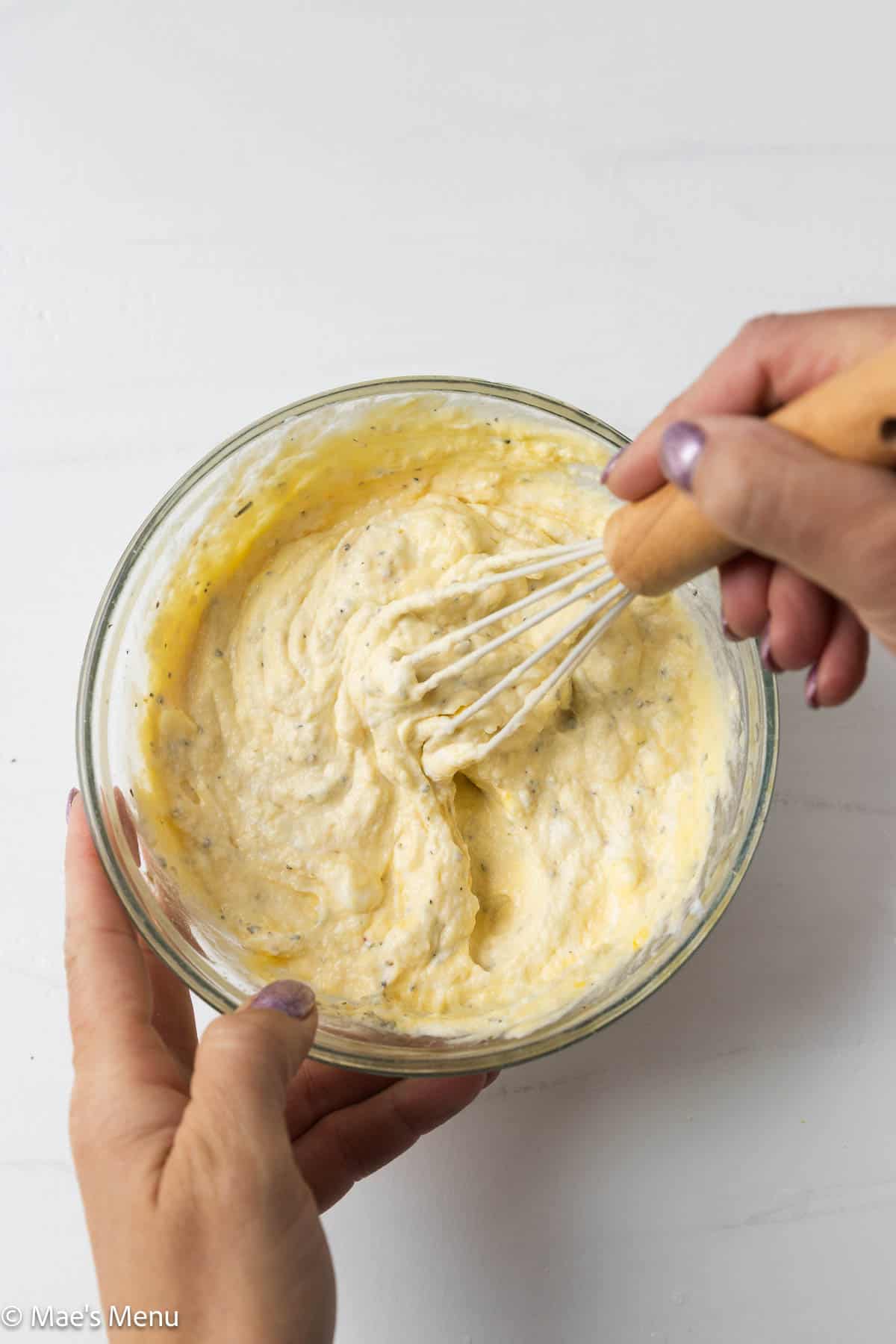 An overhead shot of whisking the ricotta filling.