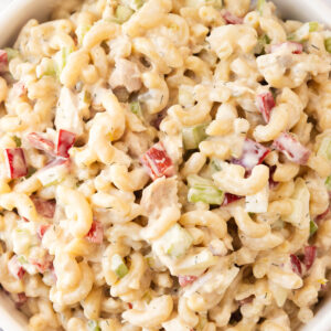 An overhead shot of a large serving bowl of tuna pasta salad.
