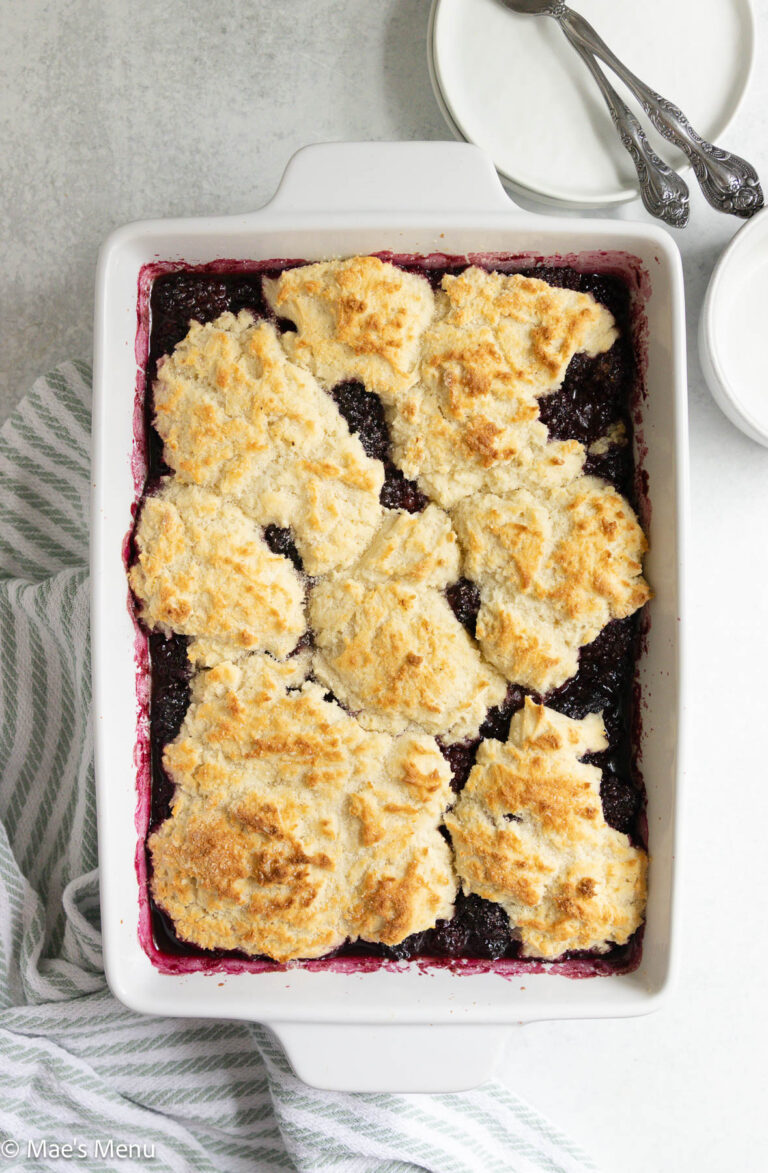 An overhead shot of a pan of fresh-baked blackberry cobbler on the counter.